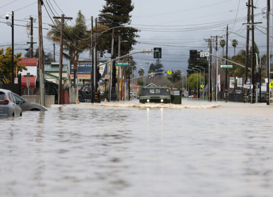 A flooded street with stormy skies overhead