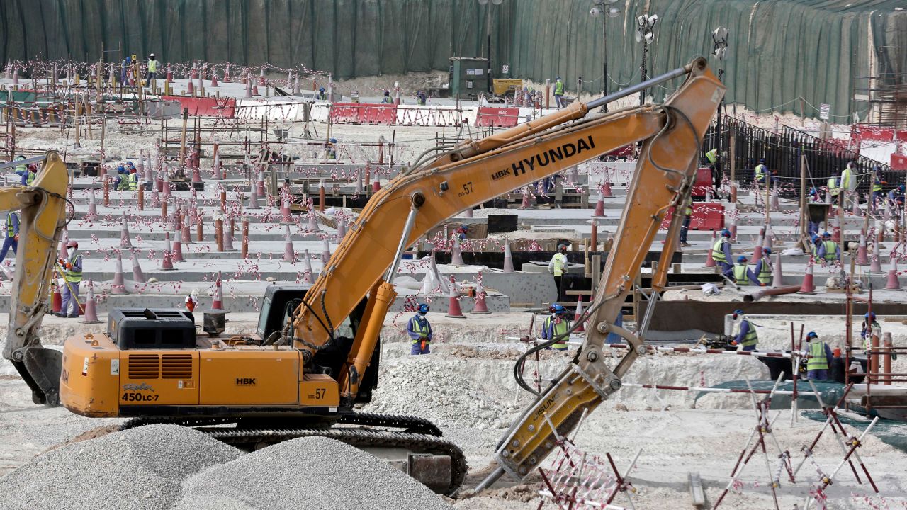 In this photo taken in May 2015 during a government organized media tour, workers use heavy machinery at the Al-Wakra Stadium being built for the 2022 World Cup.