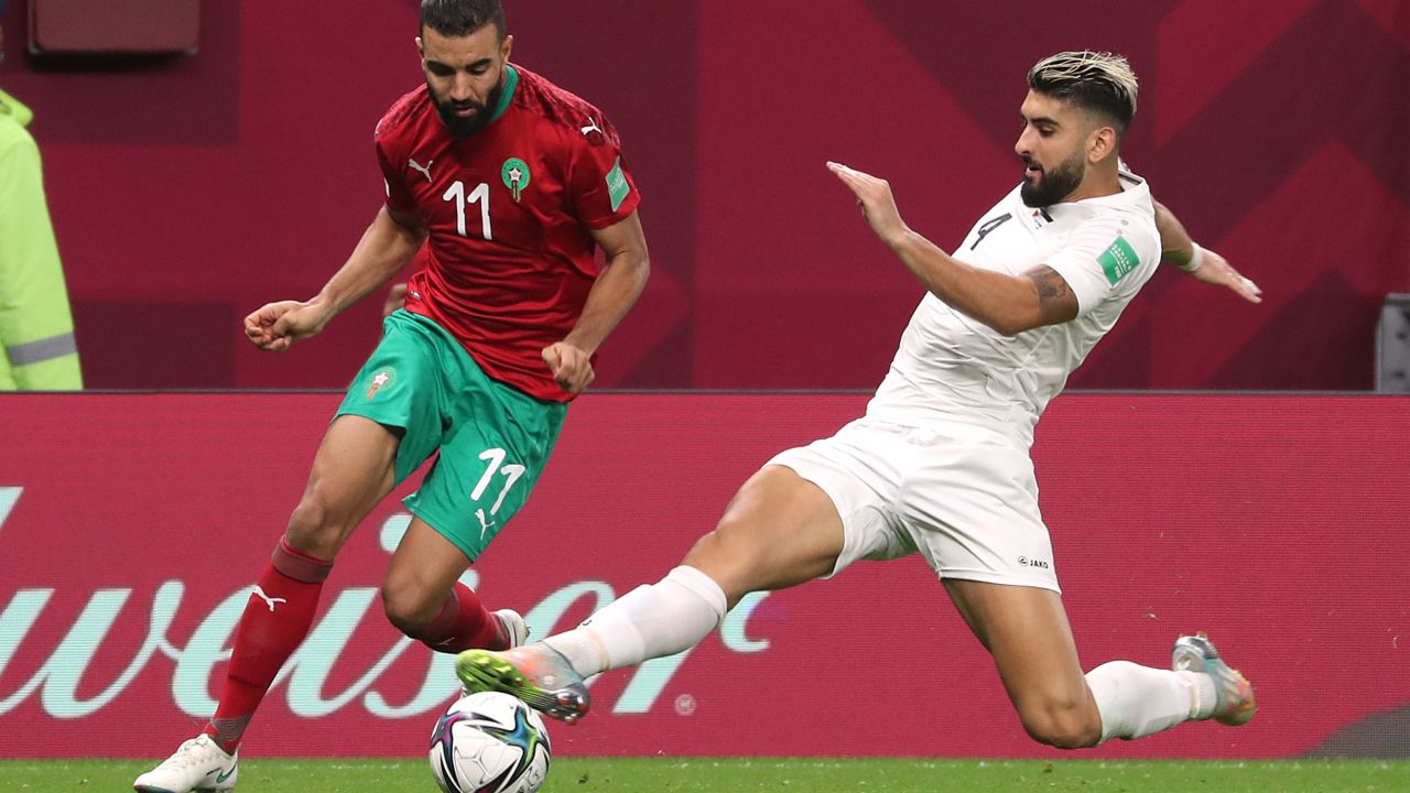 Morocco's Ismail El Haddad and Palestinian Yaser Hamed contest the ball in an Arab Cup game in December 2021.