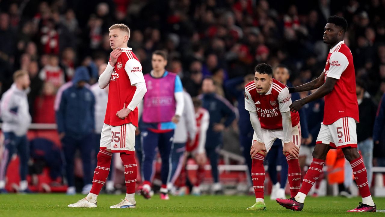 Arsenal's Oleksandr Zinchenko (left), Gabriel Martinelli (centre) and Thomas Partey look dejected after losing against Sporting CP.