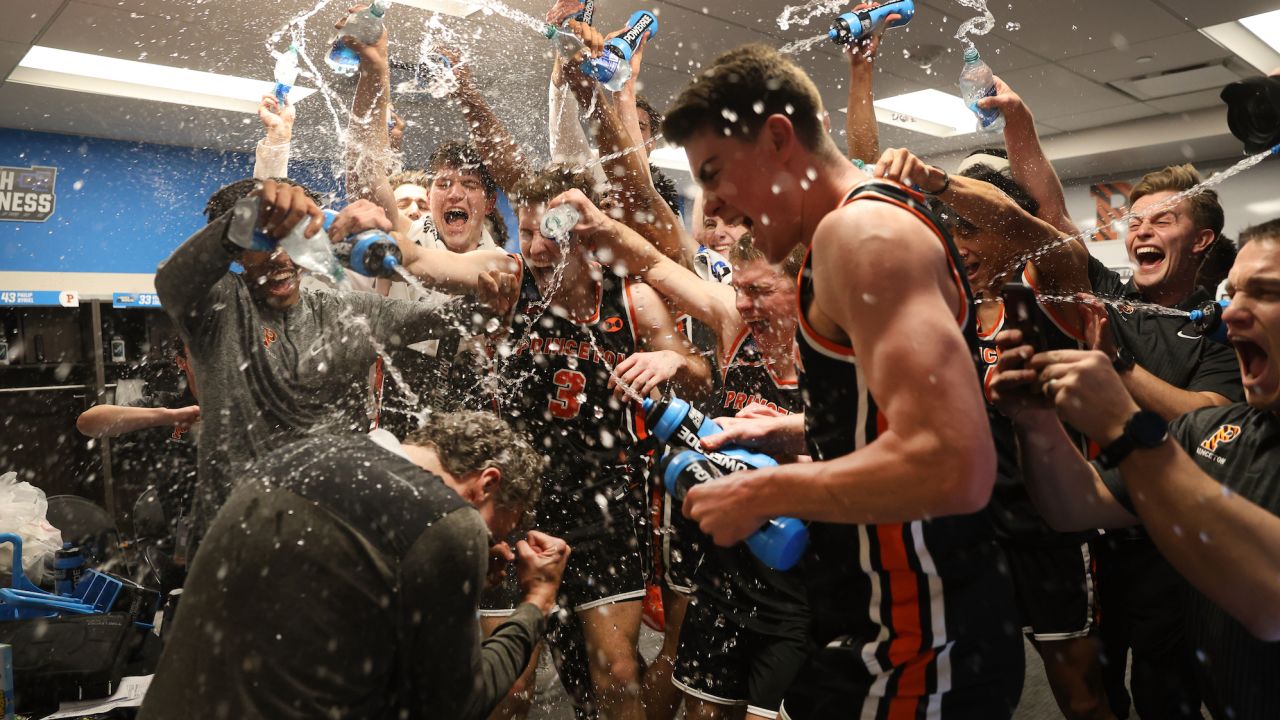 The Princeton Tigers players celebrate after beating the Arizona Wildcats.