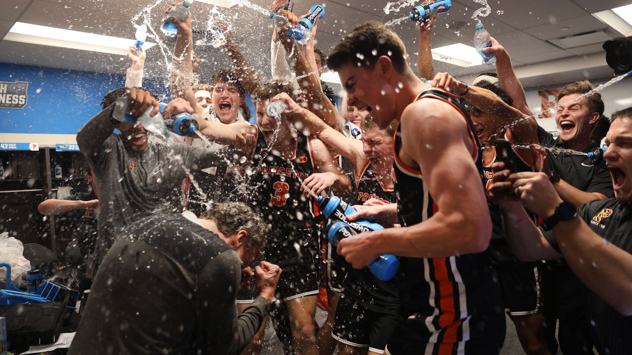 Princeton Tigers beat the Arizona Wildcats 59-55 and sprayed head coach Mitch Henderson with water after the win.