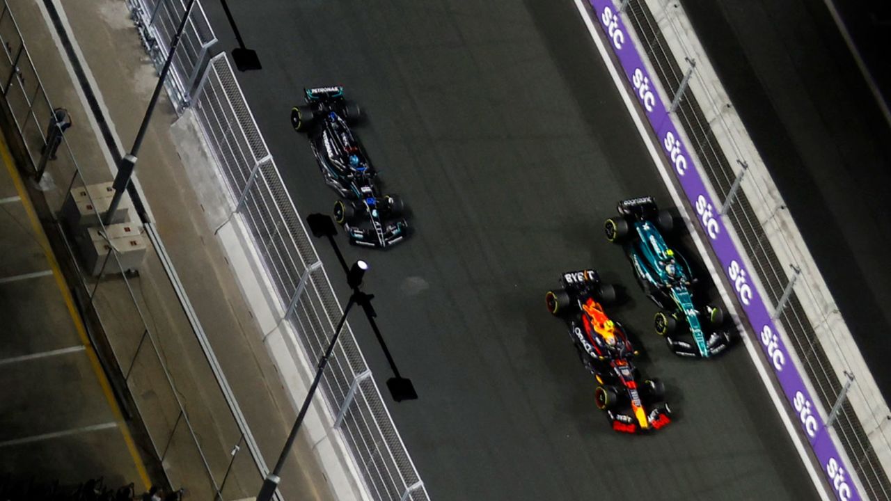 Red Bull's Sergio Perez, Aston Martin's Fernando Alonso, Mercedes' George Russell and Ferrari's Carlos Sainz in action during the race.