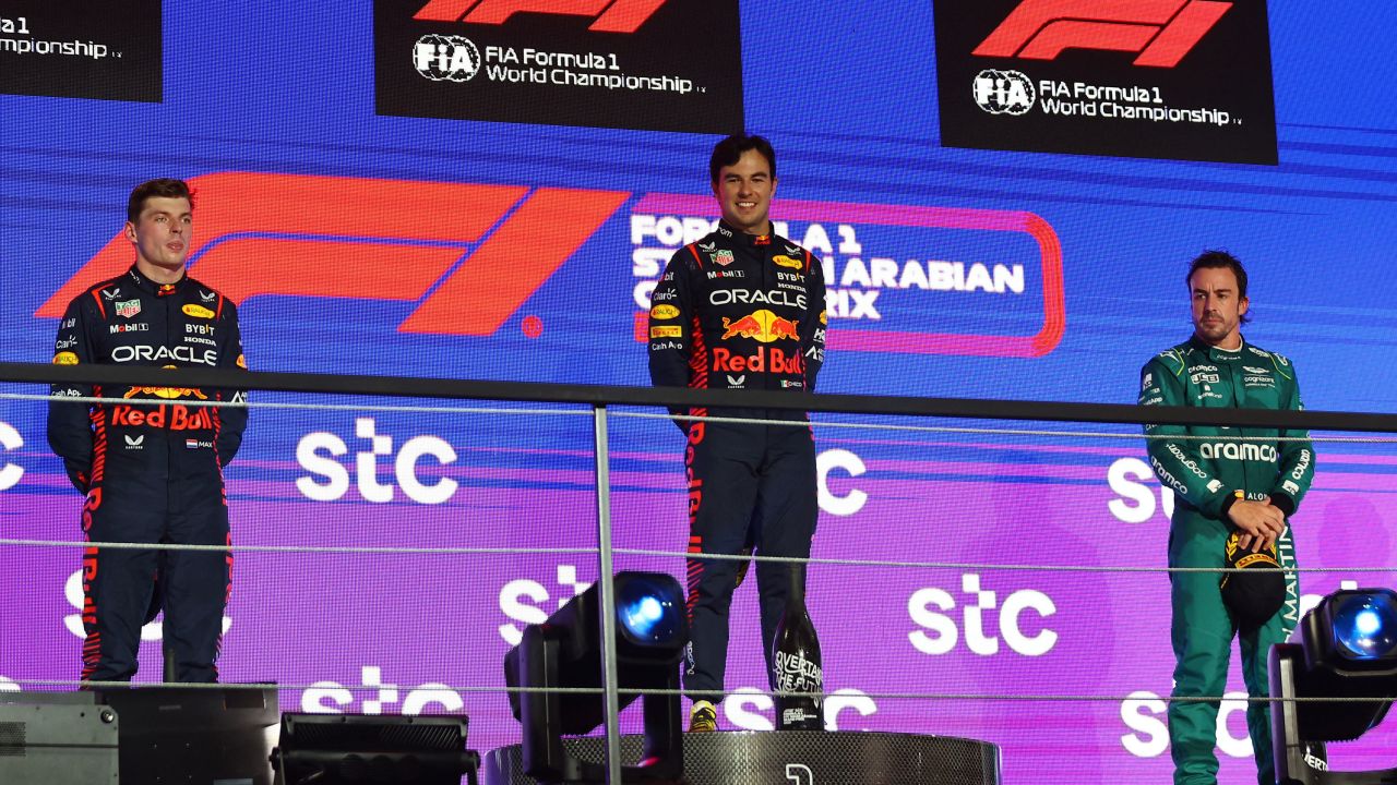 Alonso stood on the podium next to Perez and Verstappen, but was later demoted to fourth.
