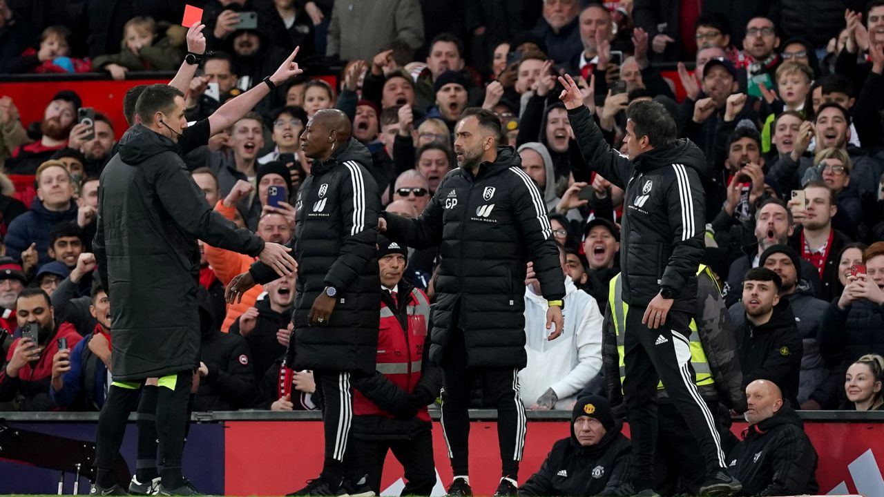 Fulham manager Marco Silva (R) is shown a red card during the FA Cup quarterfinal.