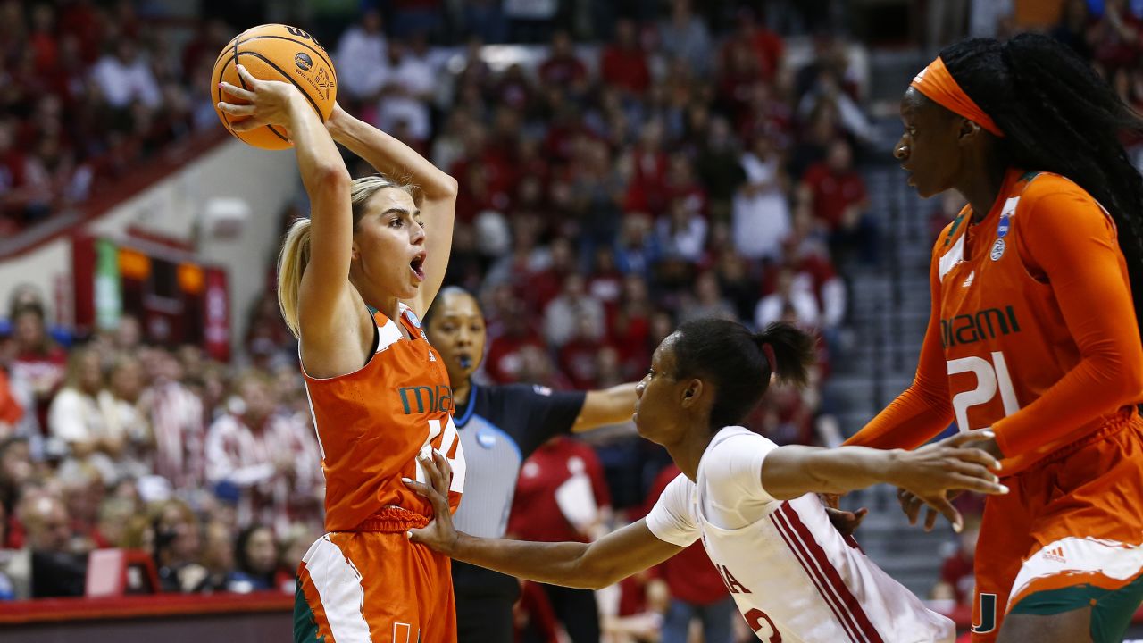 Haley Cavinder calls out to her team while being defended by Indiana Hoosiers guard Chloe Moore-McNeil.
