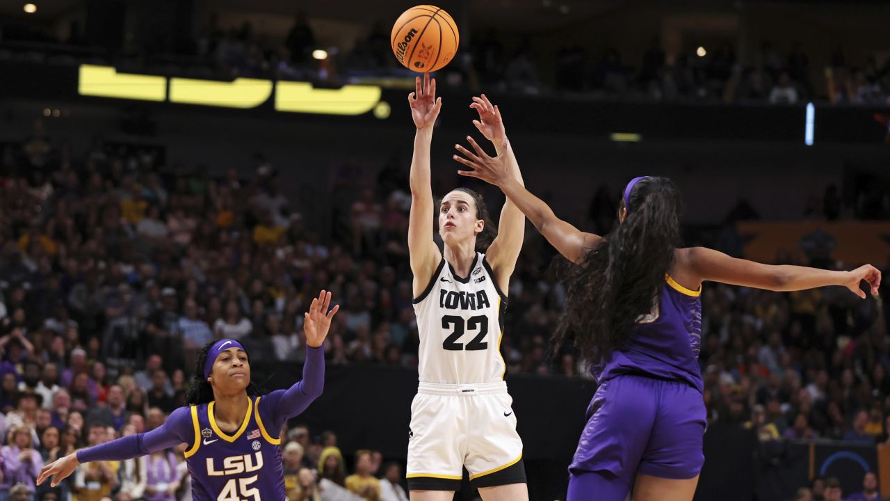 Clark shoots the ball against Reese during the fourth quarter of the championship game.