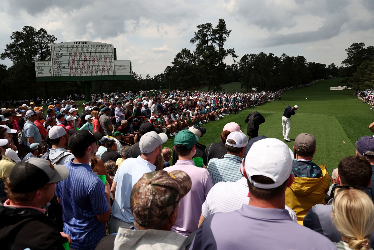 Tiger Woods tees off on the eighth hole Friday.