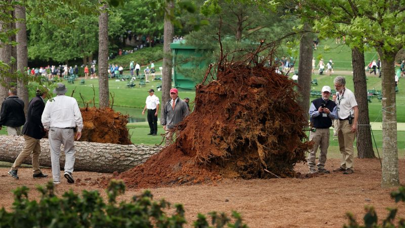 The Masters: Large trees fall at Augusta National as storms suspend play Friday