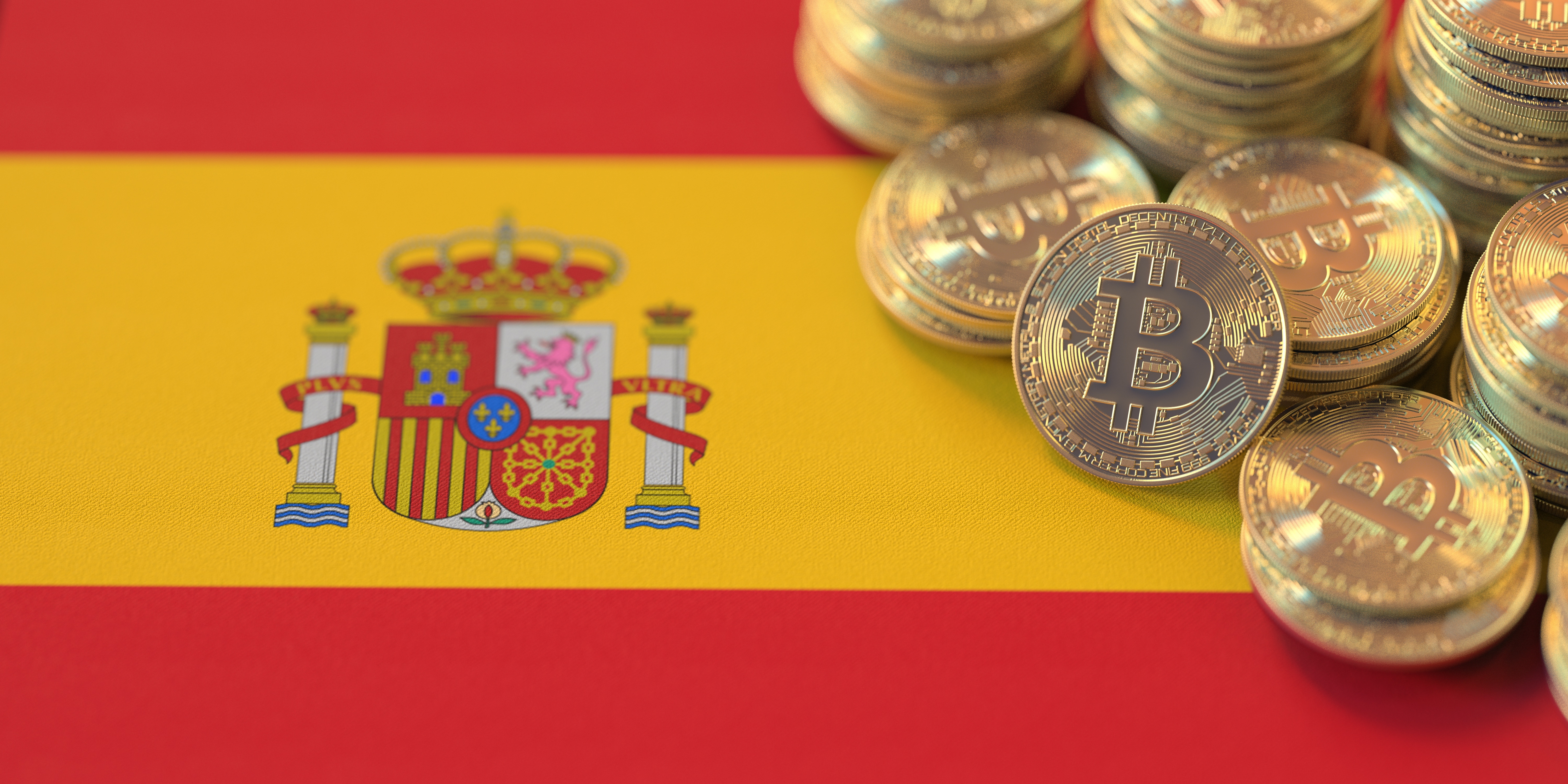 A pile of tokens representing Bitcoin on the Spanish flag.