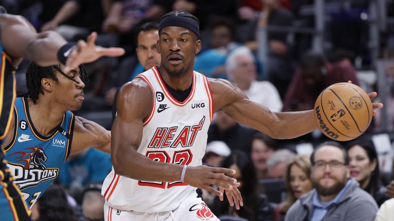 Butler dribbles defended by Detroit Pistons guard Jaden Ivey.