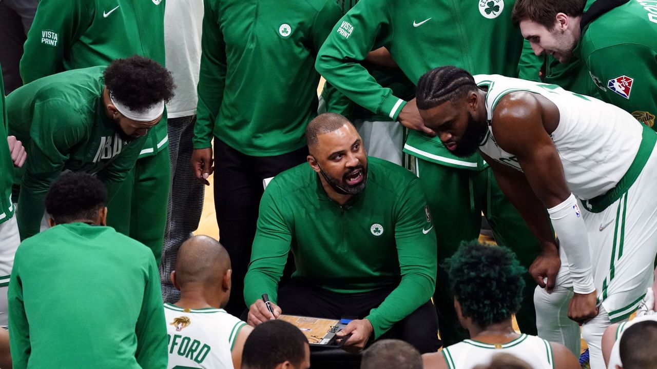 Udoka talks with Celtics players during a timeout against the Golden State Warriors last year.