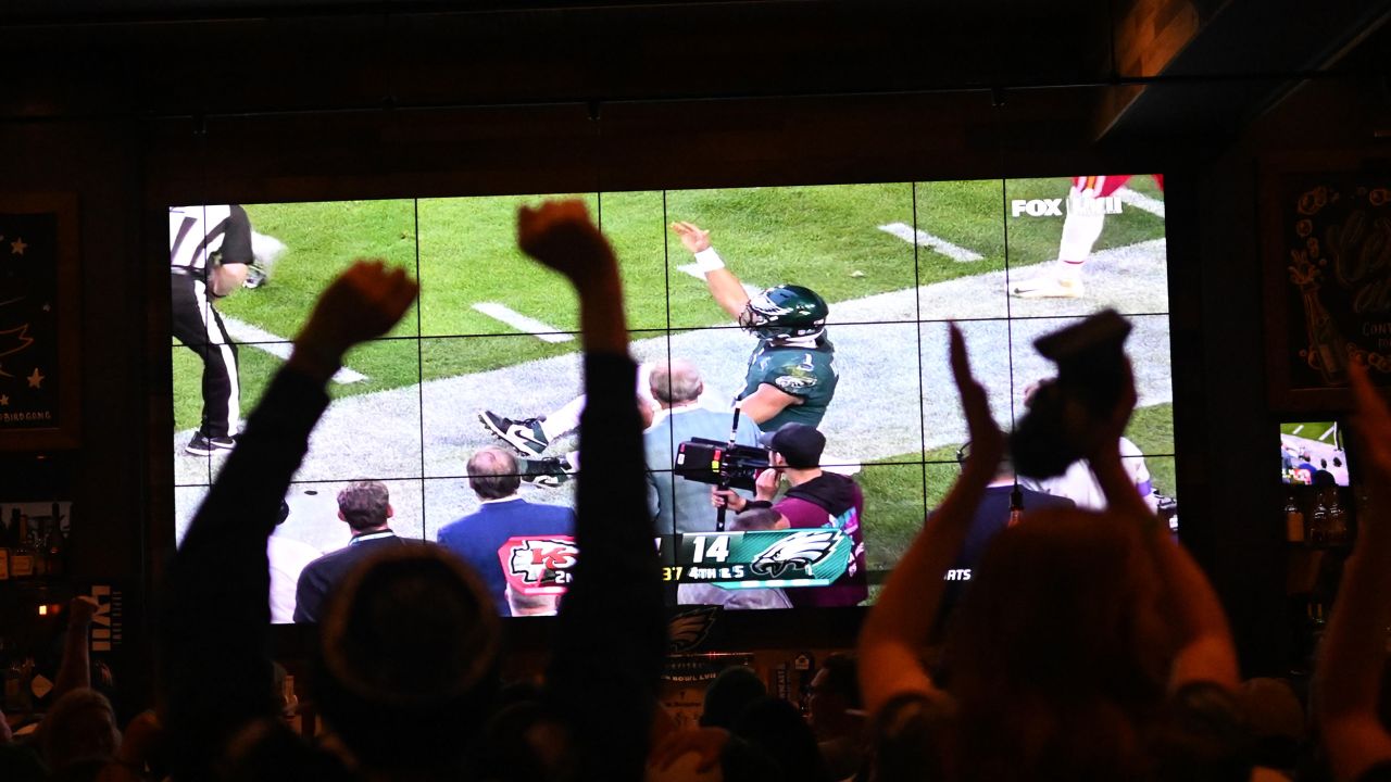 Eagles fans react while watching Super Bowl LVII at City Tap House in Philadelphia.