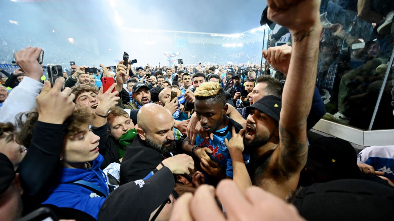 Osimhen is surrounded by Napoli fans after the team wins the Serie A title.