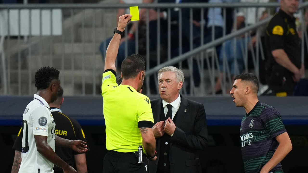 Ancelotti is yellow carded on the sidelines against Manchester City.