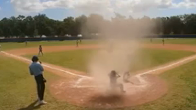 Dust devil disrupts youth baseball game. See what happens next