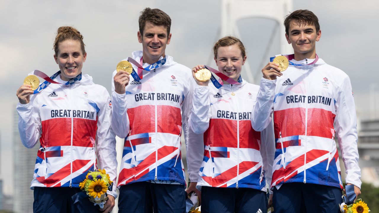 Jessica Learmonth, Jonathon Brownlee, Georgia Taylor-Brown and Alex Yee of Team Great Britain celebrate on the podium during the medal ceremony following the Mixed Relay Triathlon.