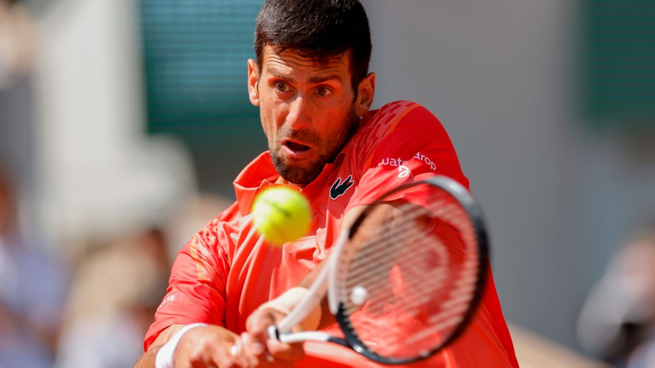 Djokovic plays a shot against Kovacevic.