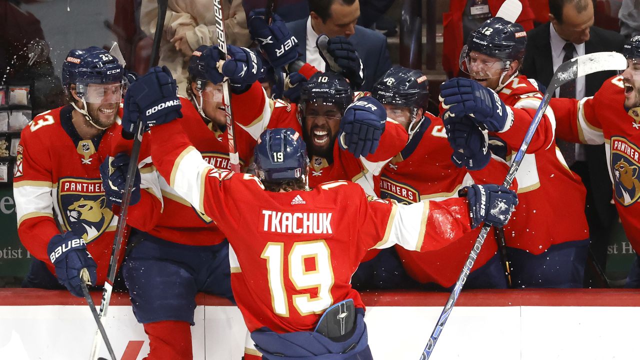 Tkachuk celebrates with his teammates after scoring the game-winning goal against the Carolina Hurricanes.