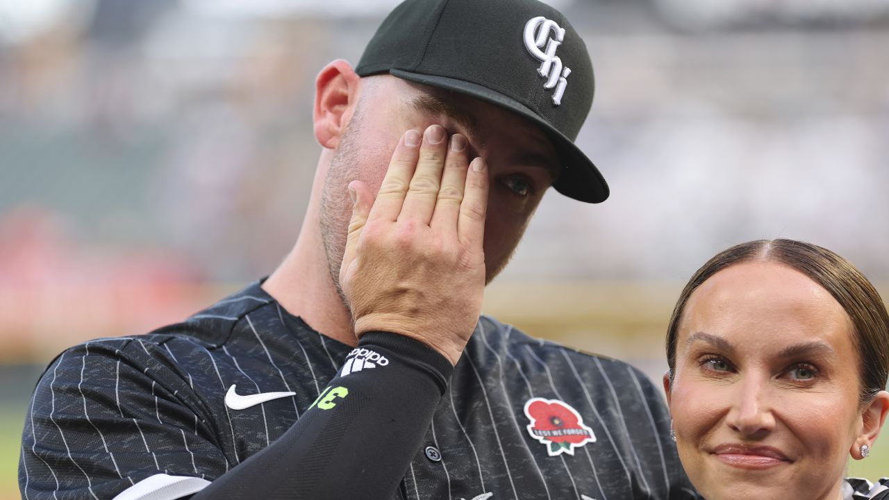 Hendriks reacts as he is acknowledged with his wife, Kristi, prior to the game against the Angels.