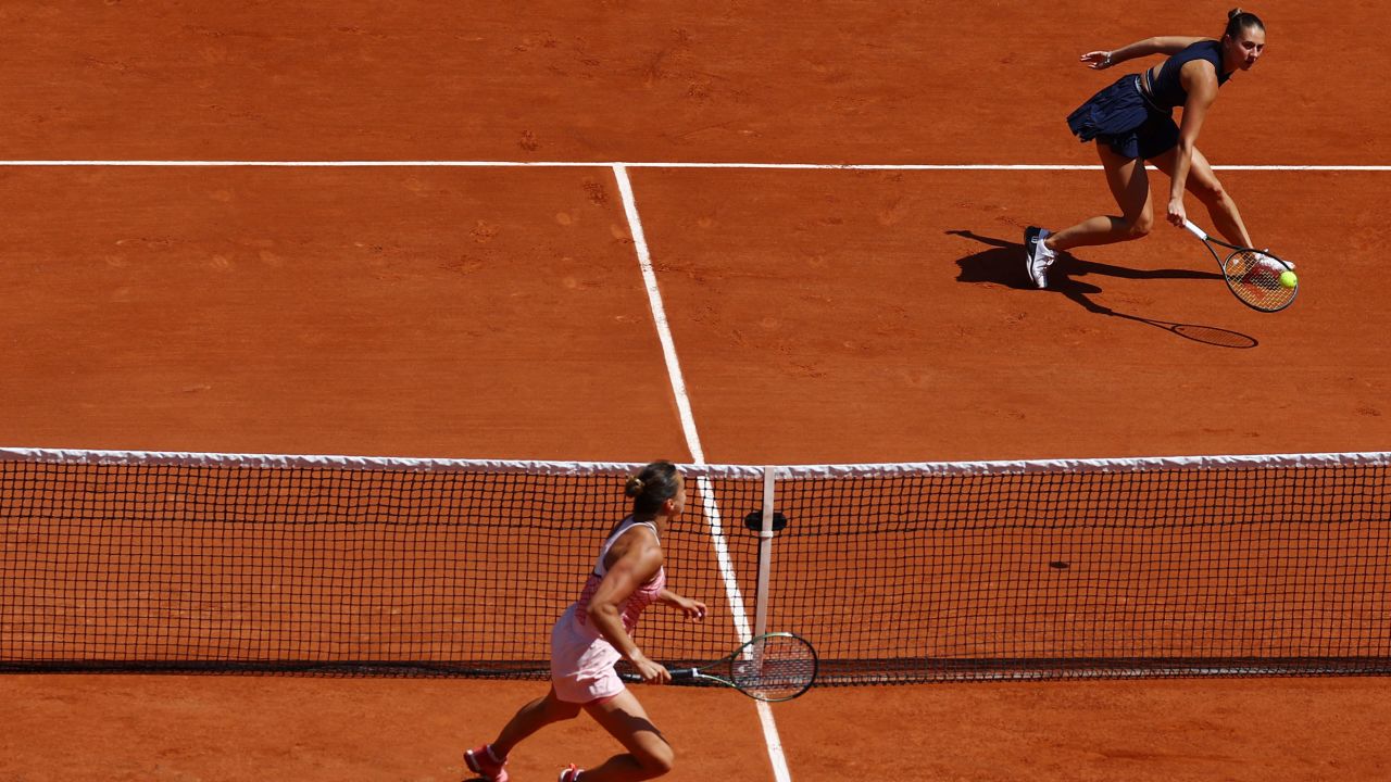 Kostyuk (right) and Sabalenka face each other at the French Open.