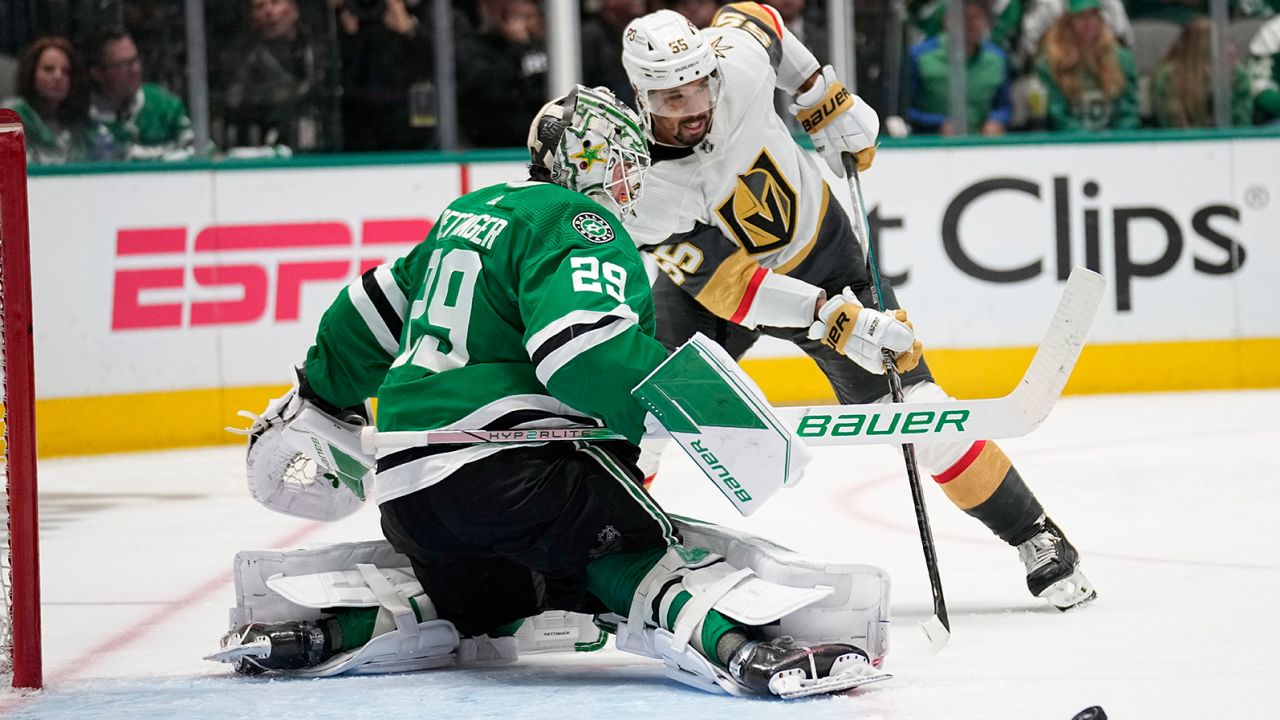 The Dallas Stars' Jake Oettinger defends as Vegas' Keegan Kolesar makes a pass during Game 6 of the NHL Western Conference Final.