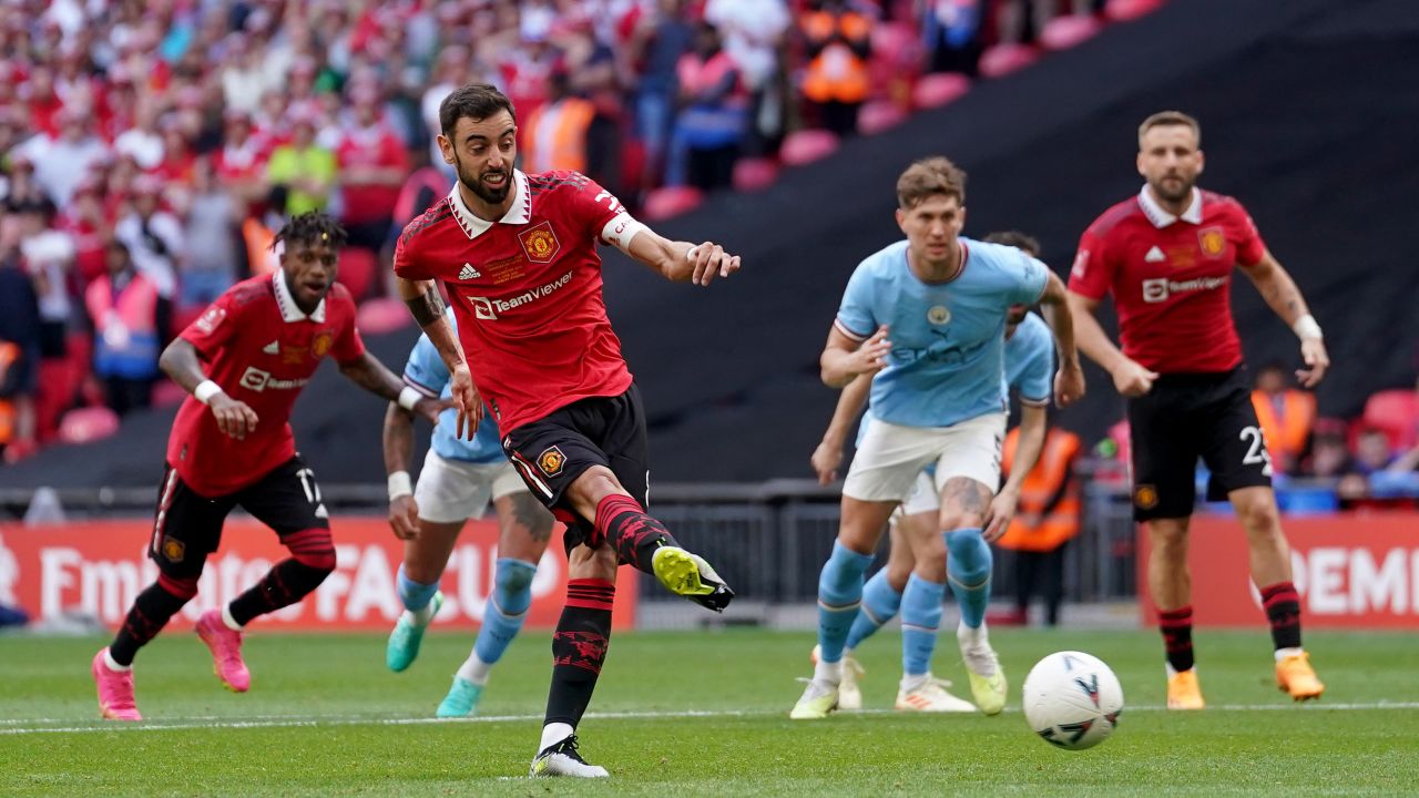 Manchester United's Bruno Fernandes scores from the penalty spot.