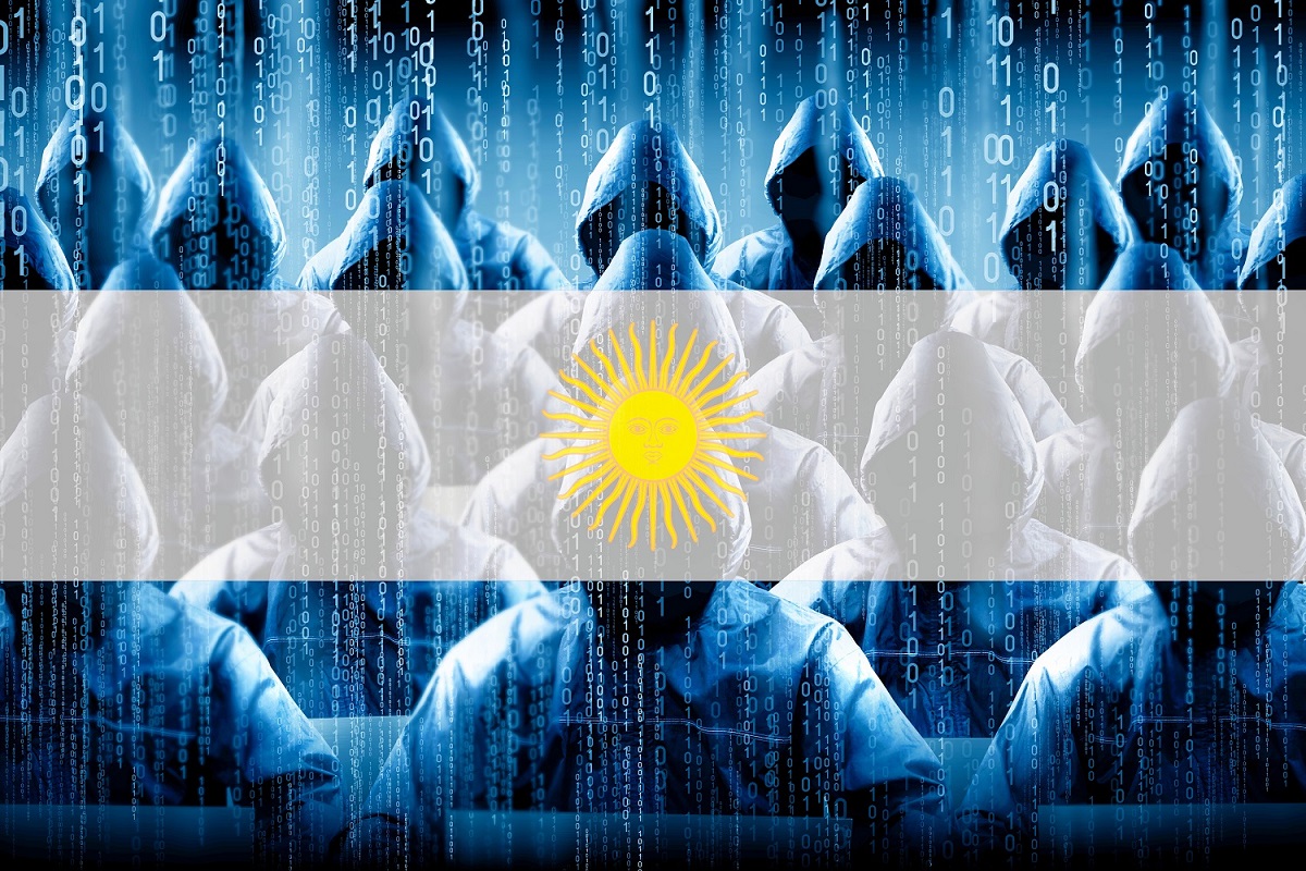 Hooded people sit at computer terminals with a binary code backdrop, with the Argentina flag in the background.