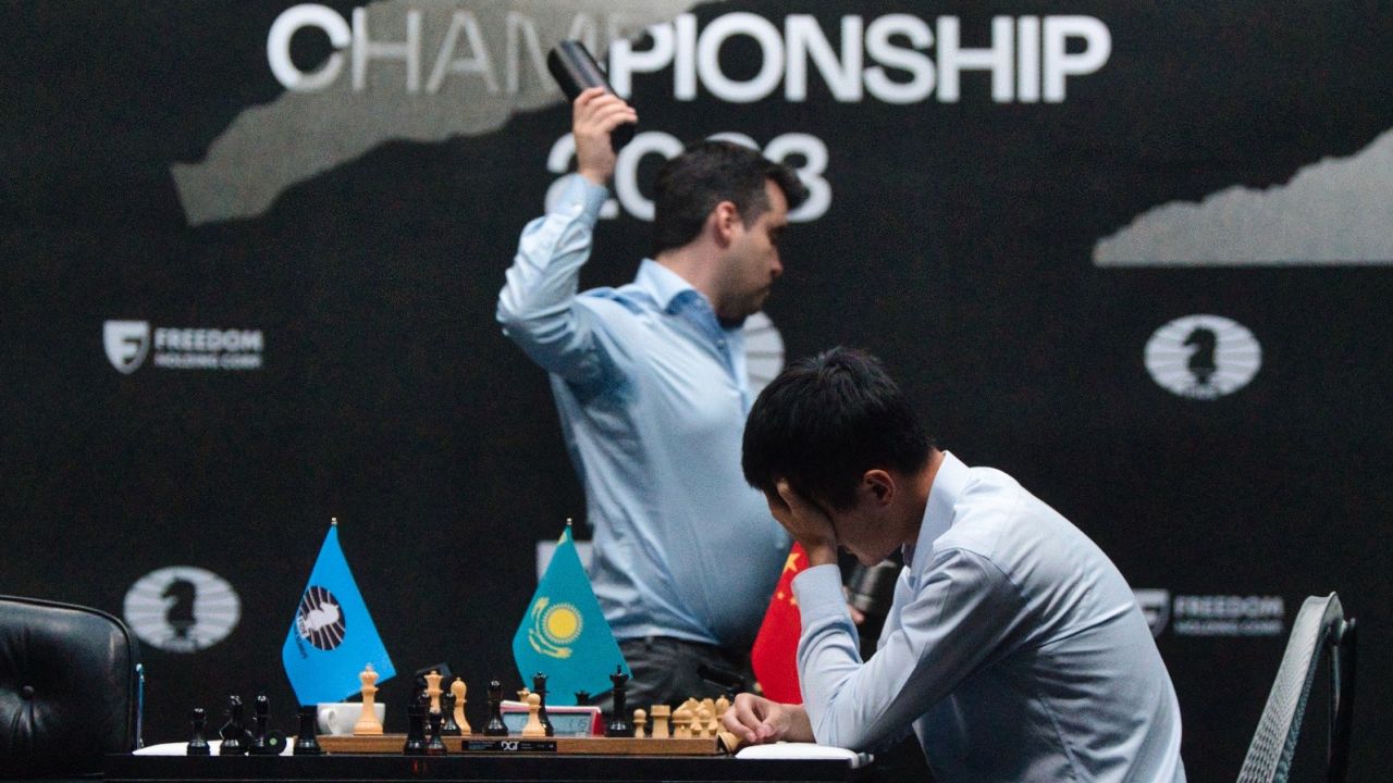 Ian Nepomniatchtchi reacts in frustration after losing a tie-break to Ding Liren in the World Championship match, while Ding's exhaustion at winning the three-week long contest is on show.