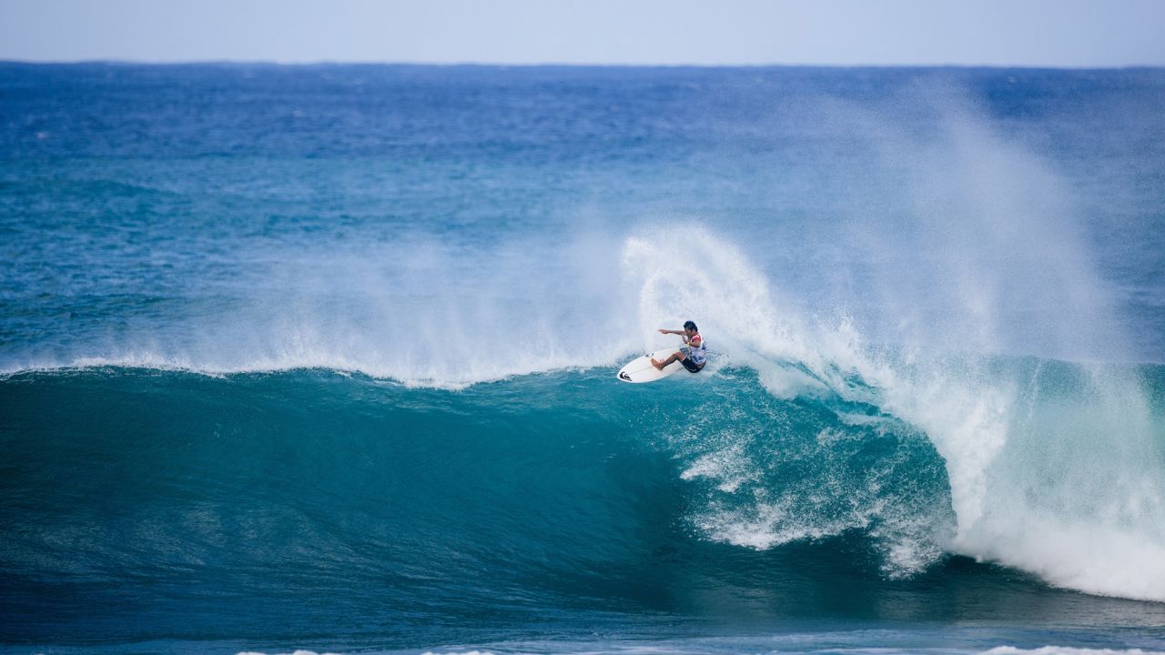 Waida catches a wave at Oahu, Hawaii, earlier this year.