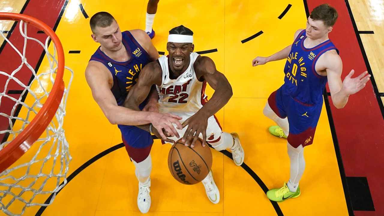 Jun 7, 2023; Miami, Florida, USA; Denver Nuggets center Nikola Jokic (15) knocks the ball away from Miami Heat forward Jimmy Butler (22) during the second half in game three of the 2023 NBA Finals at Kaseya Center. Mandatory Credit: Kyle Terada-USA TODAY Sports