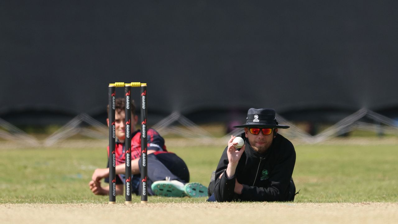 June 7, 2023, Cork, Munster, Ireland: VIDEO AVAILABLE: CONTACT INFO@COVERMG.COM TO RECEIVE**..Cricketers in Ireland were bowled over on Wednesday (07June2023) as they were forced to throw themselves to the ground to escape a marauding swarm of bees...Play was stopped during the Cricket Ireland Inter-Provincial Twenty20 Trophy match between Munster Reds and the Northern Knights at The Mardyke in Cork in the 11th over of the first innings...The swarm of stingers sent Reds batters, Warriors fielders, and spectators scrambling for cover - delaying the match by over an hour as a beekeeper had to be summoned to remove the belligerent insects...Explaining the unusual stoppage, a spokesperson for Cricket Ireland said: ‚ÄúAll the players and umpires lay down on the ground as the swarm came across to the pavilion and they swarmed around the side of the clubhouse before eventually settling on the fence in front of the pavilion. ..‚ÄúObviously it was too dangerous to continue with play due to the fact a ball could hit the hive and the bees could attack, so play was suspended.‚Äù..The reason why the bees swarmed has left officials stumped - but help was at hand as a specialist was called in to remove the bees from the field...‚ÄúThe club contacted a local beekeeper,‚Äù the spokesperson said. ‚ÄúAfter about 40 minutes or so Mauro Dias from Buzz of Nature (Bee rescue specialists) arrived and managed to secure the Queen bee and put her in a box and waited for the family to join her. After a break of an hour and a half, the bees were brought away.‚Äù..After the delay, the match was reduced to 12 overs per side, with the Warriors left buzzing after running out the winners by seven wickets - chasing down a target of 129 with eight balls to spare...Where: Cork, Munster, Ireland.When: 07 Jun 2023.Credit: Oisin Keniry/Cricket Ireland/Cover Images..**EDITORIAL USE ONLY. MATERIALS ONLY TO BE USED IN CONJUNCTION WITH  (Credit Image: © Cover Images via ZUMA Press