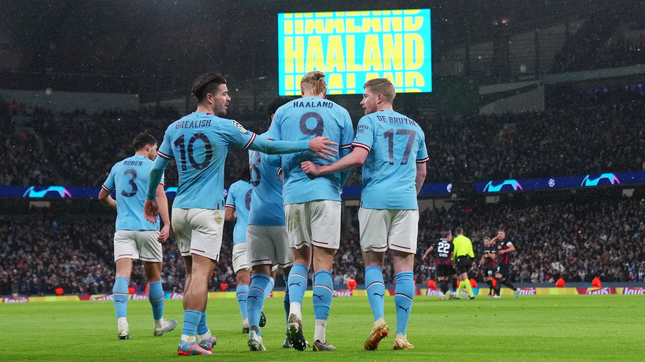 MANCHESTER, ENGLAND - MARCH 14: Erling Haaland of Manchester City celebrates with Jack Grealish and Kevin De Bruyne after scoring the team's first goal during the UEFA Champions League round of 16 leg two match between Manchester City and RB Leipzig at Etihad Stadium on March 14, 2023 in Manchester, England. (Photo by Lexy Ilsley - Manchester City/Manchester City FC via Getty Images)