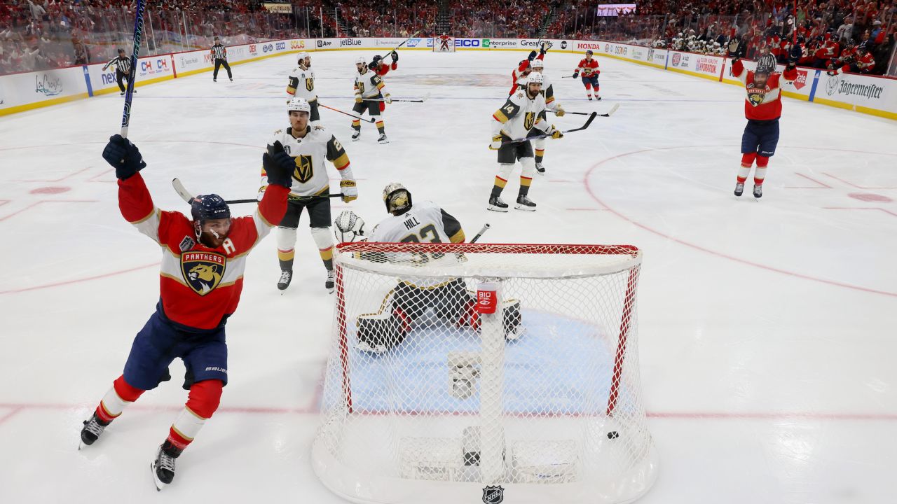 SUNRISE, FLORIDA - JUNE 08:  Adin Hill #33 of the Vegas Golden Knights allows the game-winning goal by Carter Verhaeghe #23 of the Florida Panthers during the first overtime period as Matthew Tkachuk #19 celebrates to give the Panthers a 3-2 win in Game Three of the 2023 NHL Stanley Cup Final at FLA Live Arena on June 08, 2023 in Sunrise, Florida. (Photo by Bruce Bennett/Getty Images)