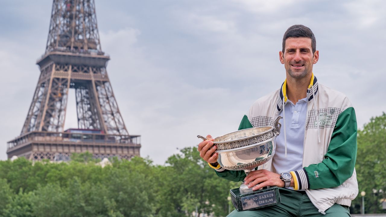 Djokovic poses with the French Open trophy in front of the Eiffel Tower.