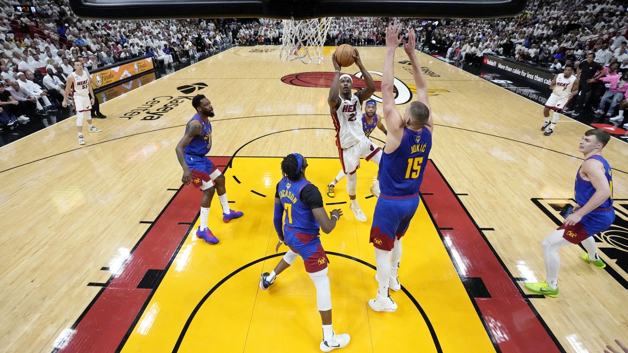 Jun 7, 2023; Miami, Florida, USA; Miami Heat forward Jimmy Butler (22) shoots the ball against the Denver Nuggets during the first half in game three of the 2023 NBA Finals at Kaseya Center. Mandatory Credit: Wilfredo Lee/Pool Photo-USA TODAY Sports