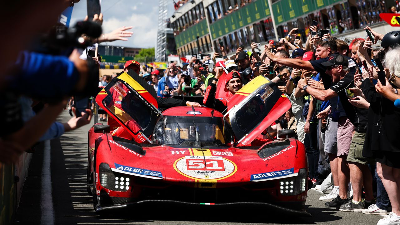 LE MANS, FRANCE - JUNE 11: Race winners, the #51 AF Corse Ferrari 499P of James Calado, Alessandro Pier Guidi, and Antonio Giovinazzi arrive down the pit lane towards parc ferme at the end of the 100th anniversary of the 24 Hours of Le Mans at the Circuit de la Sarthe on June 11, 2023 in Le Mans, France. (Photo by James Moy Photography/Getty Images)