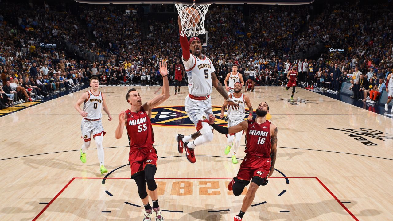 Kentavious Caldwell-Pope of the Denver Nuggets drives to the basket against the Miami Heat during Game Five of the 2023 NBA Finals on June 12, 2023 at Ball Arena in Denver, Colorado.