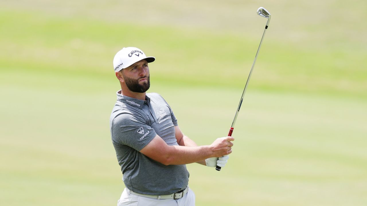 Rahm plays a shot during a practice round.