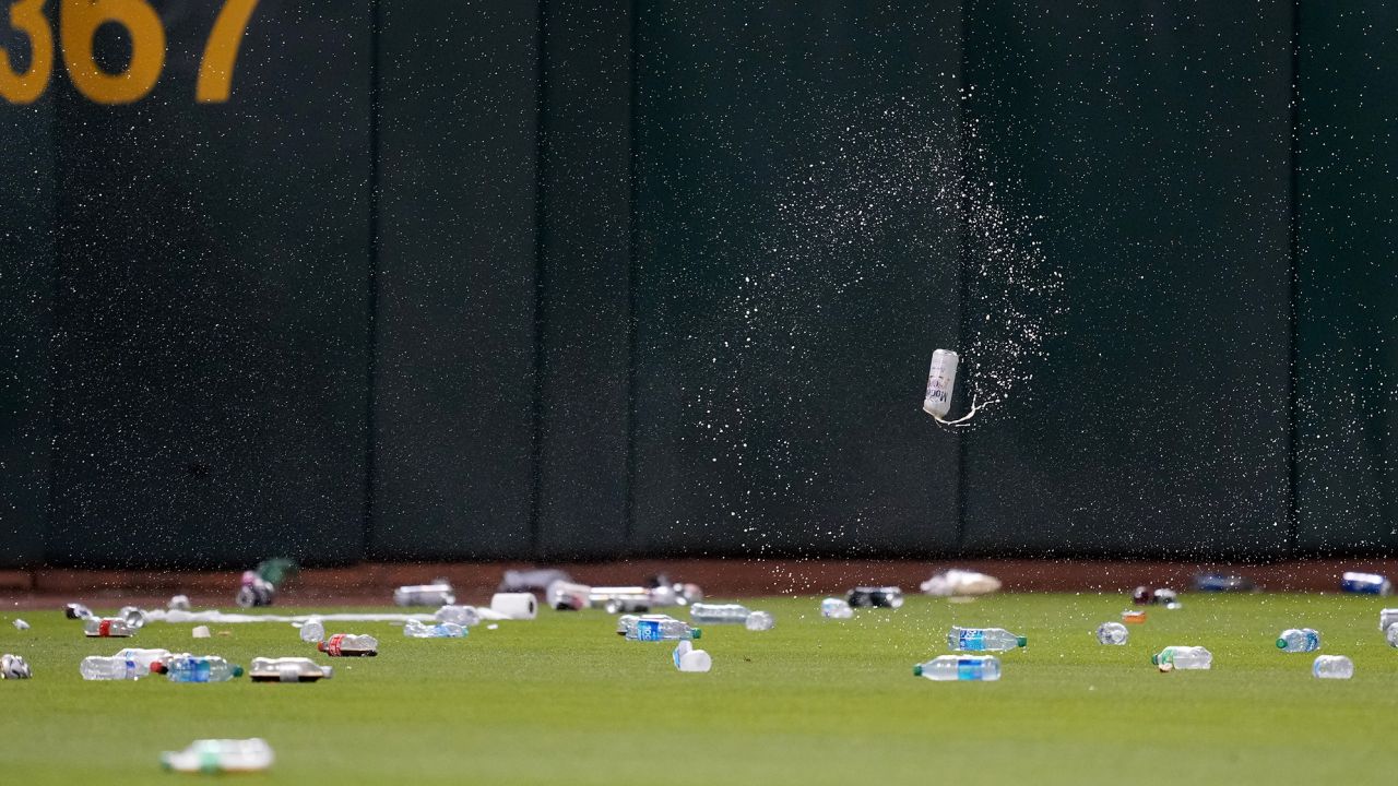 OAKLAND, CALIFORNIA - JUNE 13: Oakland Athletics fans throw garbage onto the field after a reverse boycott game at RingCentral Coliseum on June 13, 2023 in Oakland, California. (Photo by Brandon Vallance/Getty Images)