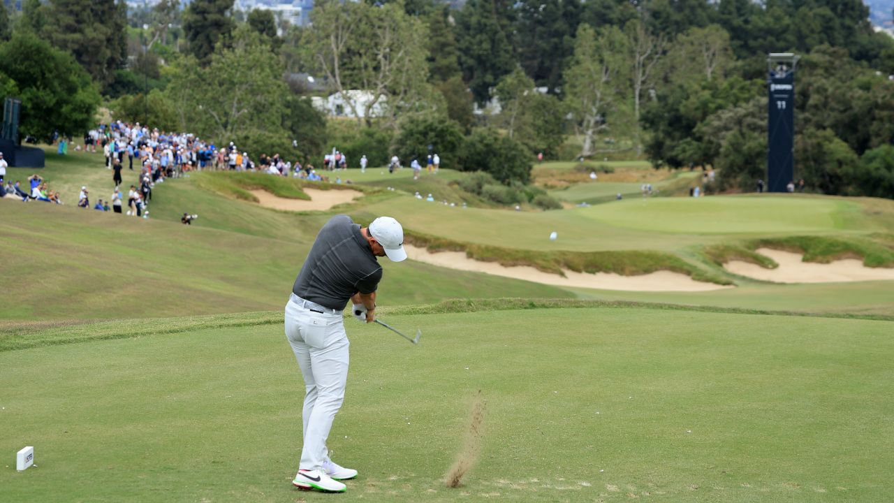 McIlroy plays a shot on the 11th hole.