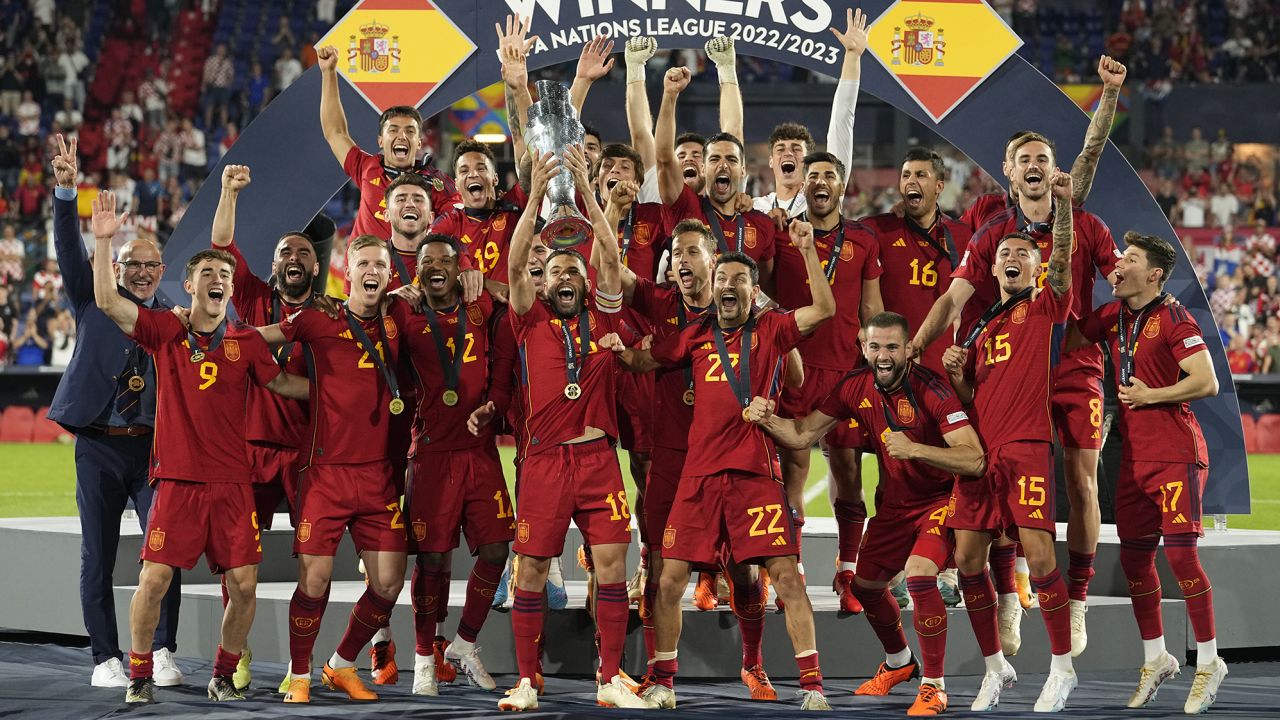 Spain players celebrate with the trophy after winning the Nations League final soccer match between Croatia and Spain at De Kuip stadium in Rotterdam, Netherlands, Sunday, June 18, 2023. (AP Photo/Martin Meissner)