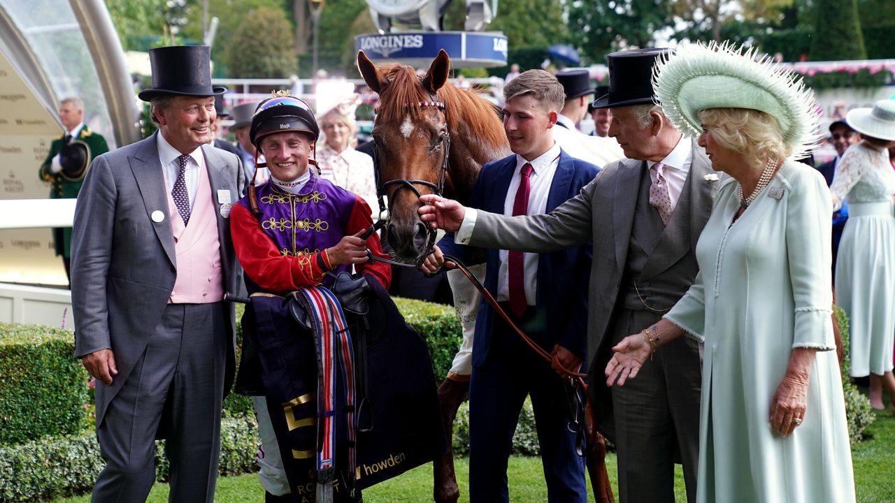 King Charles III and Queen Camilla, owners of Desert Hero ridden by Tom Marquand (second left), and trained by William Haggas (left) following victory in the King George V Stakes on day three of Royal Ascot at Ascot Racecourse, Berkshire. Picture date: Thursday June 22, 2023. (Photo by John Walton/PA Images via Getty Images)