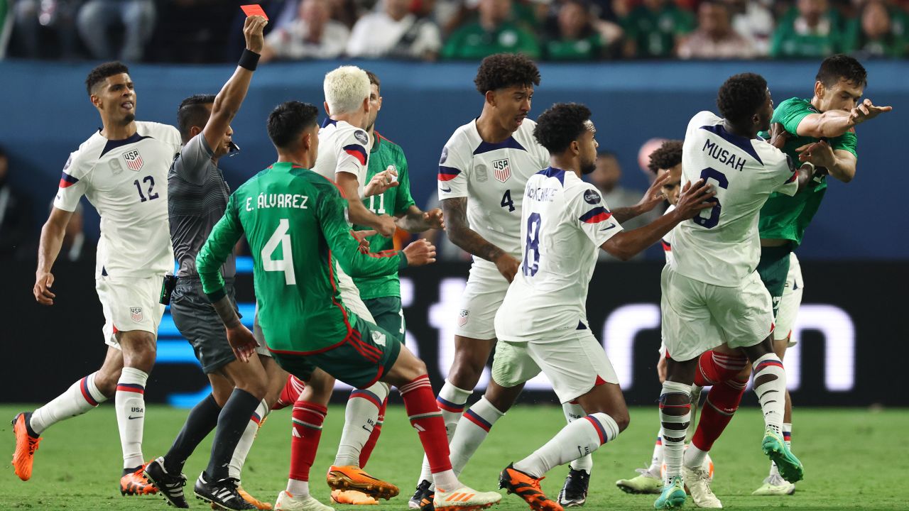 Cesar Montes of Mexico clashes with Yunus Musah of USA as Referee Ivan Barton from El Salvador shows his a red card during the CONCACAF Nations League Semi Final between Mexico and United States of America at Allegiant Stadium on June 15, 2023 in Las Vegas, Nevada.