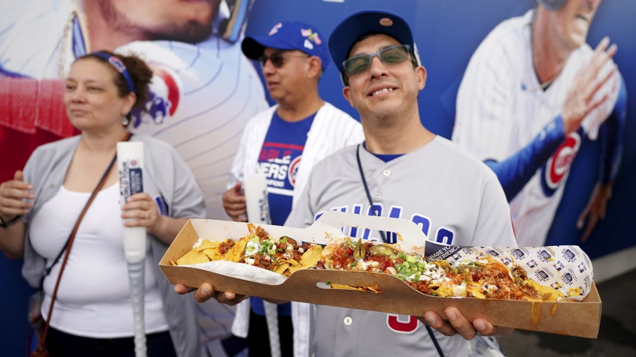 A fan poses with an ultra-long carrier of nachos ahead of the MLB London Series match at the London Stadium, London. Picture date: Saturday June 24, 2023. (Photo by Zac Goodwin/PA Images via Getty Images)