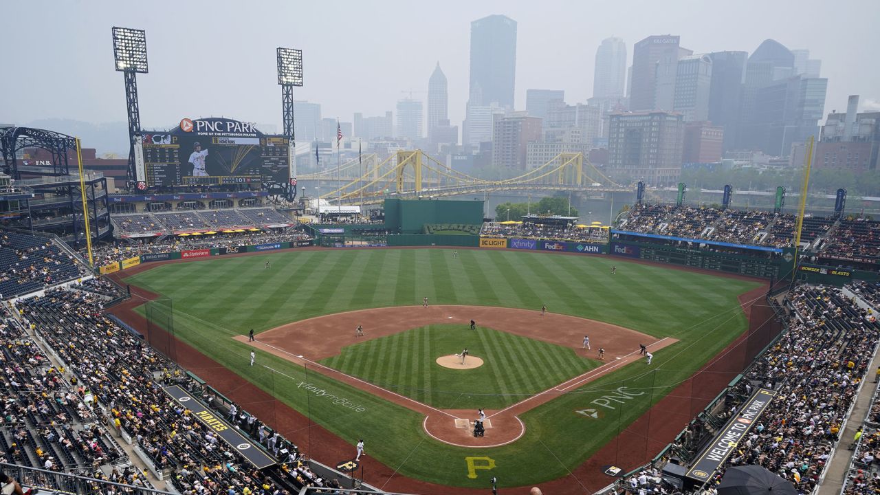 Haze from Canadian wildfires hangs over downtown Pittsburgh and PNC Park during a baseball game between the Pittsburgh Pirates and the San Diego Padres in Pittsburgh, Thursday, June 29, 2023. (AP Photo/Gene J. Puskar)