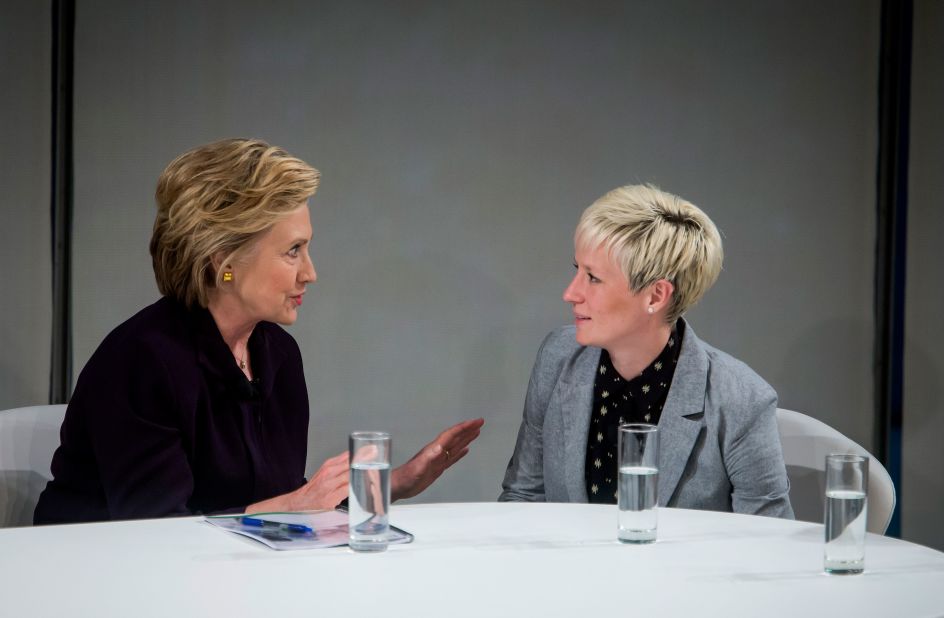 Former US Secretary of State Hillary Clinton speaks with Rapinoe during a roundtable discussion on pay equality in New York in 2016. Rapinoe has been a long-time advocate of equal pay in sport.