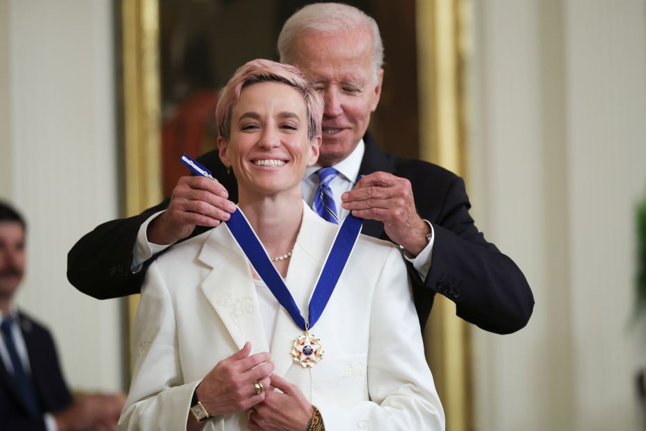 President Biden presents the Presidential Medal of Freedom to Rapinoe at the White House in July 2022. She became the first soccer player to receive the award.<br />