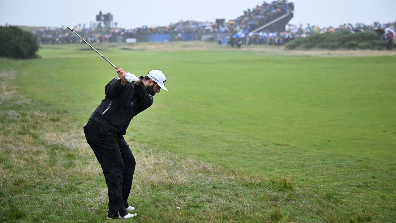 Rahm plays a shot on the eighth hole.