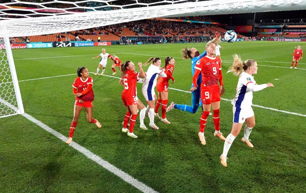 Swiss players, in red, defend their box during a match against Norway on July 25. The match ended in a 0-0 draw.